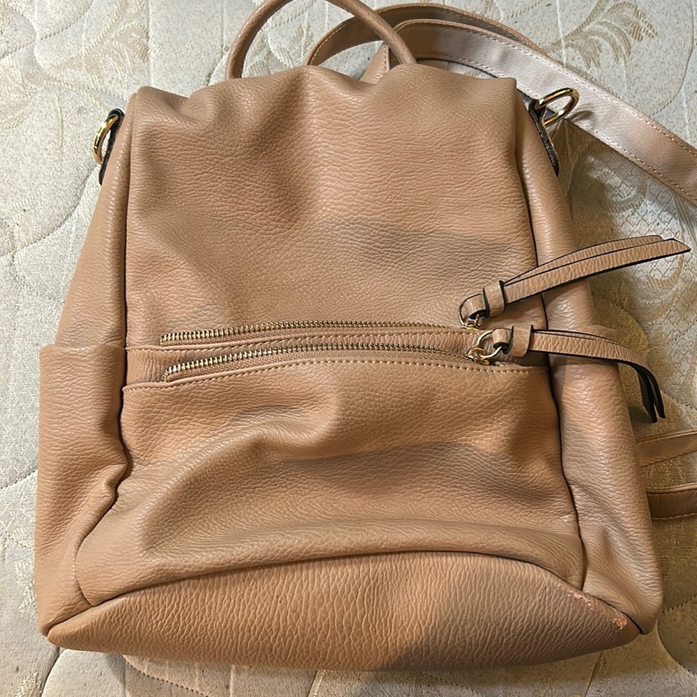 Cute tan backpack with cheetah print design on the inside. Used twice.Adjustable